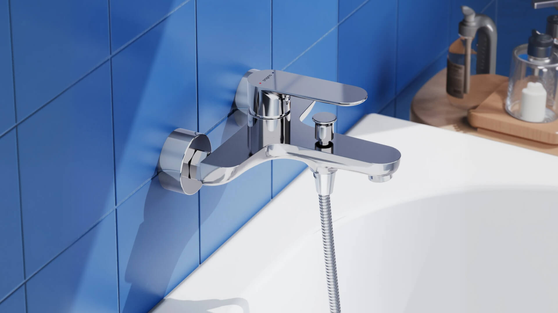 Photorealistic 3D render of a chrome bathtub mixer against a blue tile background for the Pragma brand.